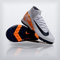 Tachos Jr. Mercurial Superfly 10 TF Safari Naranja — X Cleats MX